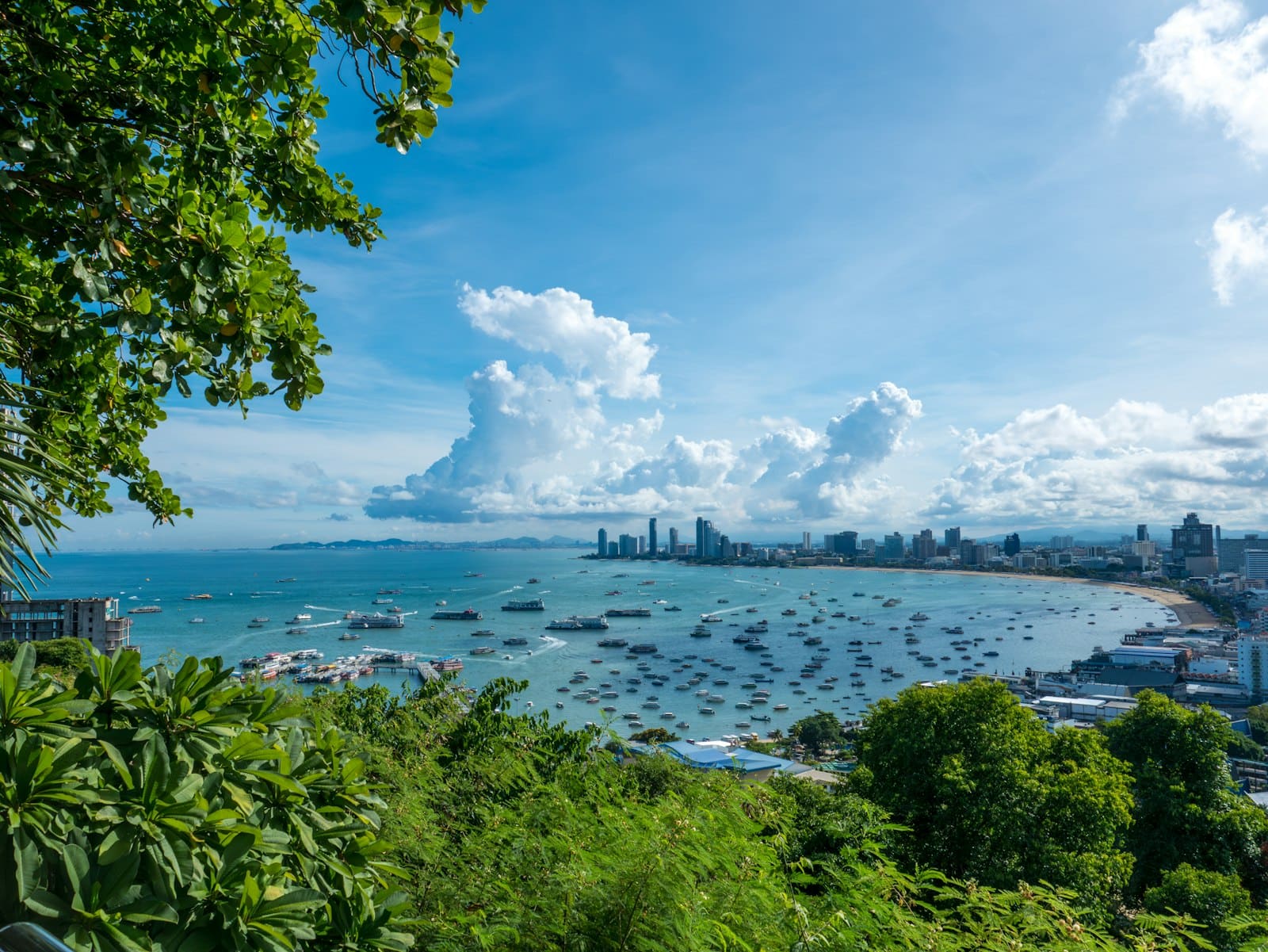 Panorama of Pattaya bay with skyscrapers and speedboats